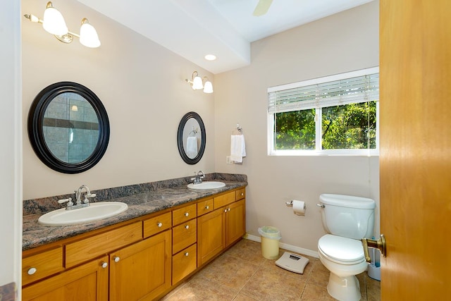 bathroom with tile patterned floors, vanity, and toilet