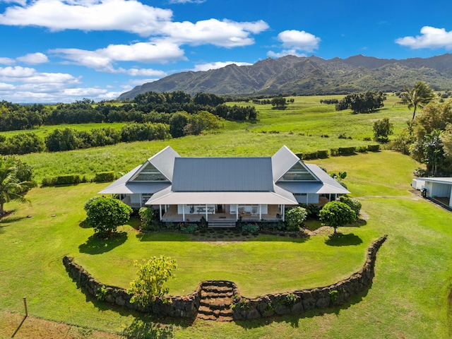 drone / aerial view with a mountain view and a rural view