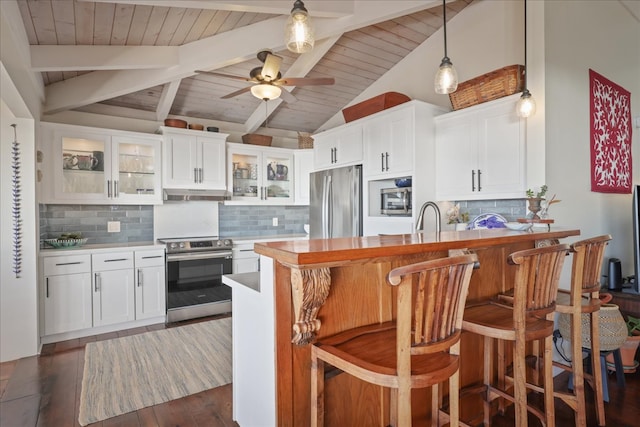 kitchen featuring dark wood-type flooring, white cabinets, and stainless steel appliances