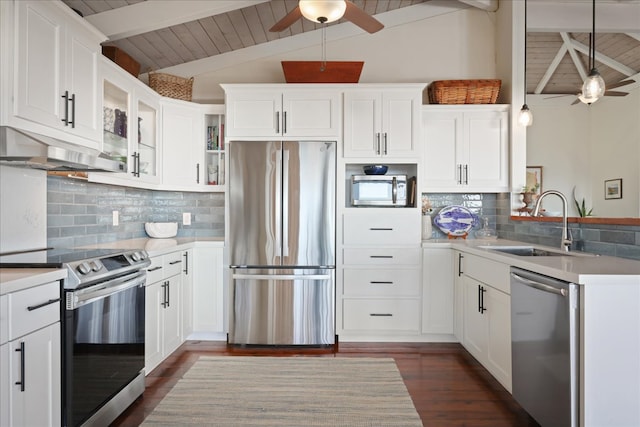 kitchen with white cabinets, hanging light fixtures, decorative backsplash, dark hardwood / wood-style floors, and stainless steel appliances