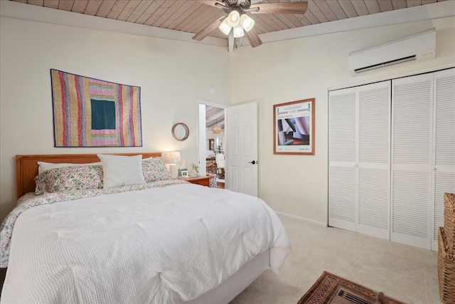 bedroom featuring ceiling fan, a closet, wood ceiling, and a wall mounted air conditioner