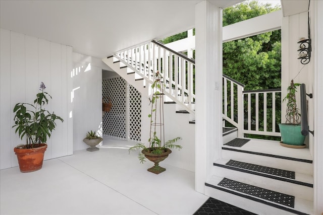 stairs with concrete floors