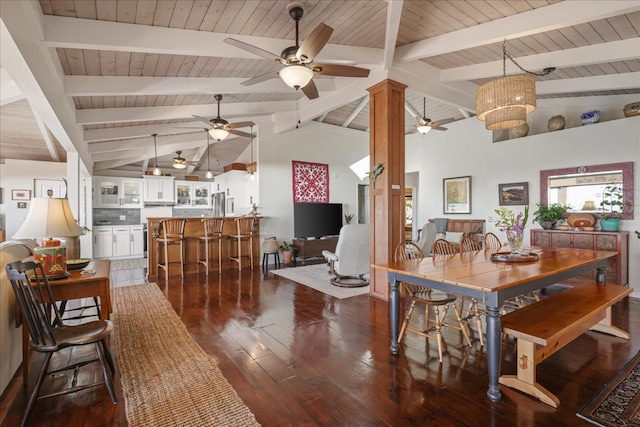 dining space with beamed ceiling, dark hardwood / wood-style flooring, an inviting chandelier, and high vaulted ceiling