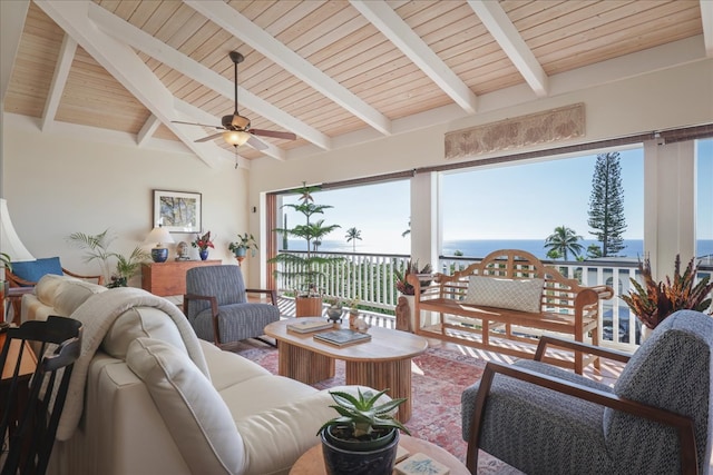 living room featuring vaulted ceiling with beams, ceiling fan, a water view, and wood ceiling