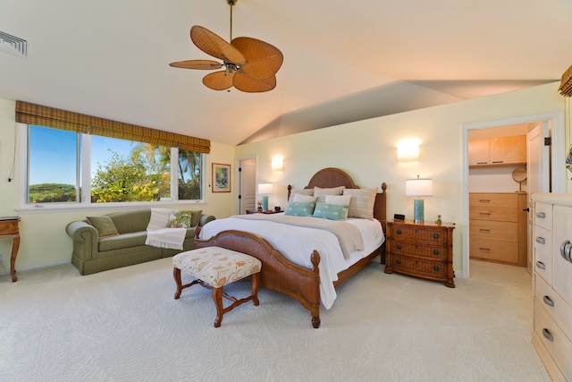 bedroom featuring ceiling fan, light colored carpet, and lofted ceiling