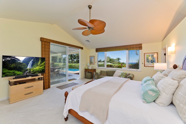 bedroom featuring ceiling fan, vaulted ceiling, access to outside, and multiple windows