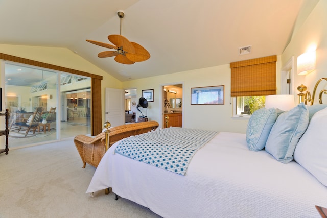 carpeted bedroom with ceiling fan, ensuite bathroom, access to outside, and vaulted ceiling