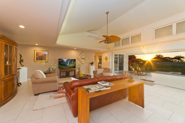 living room featuring ceiling fan, light tile patterned floors, and vaulted ceiling