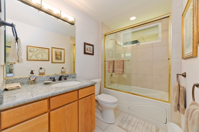 full bathroom with tile patterned flooring, vanity, toilet, and enclosed tub / shower combo