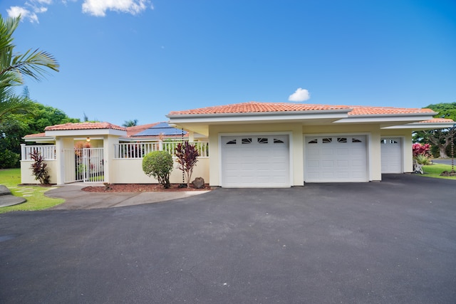 mediterranean / spanish-style house featuring a garage