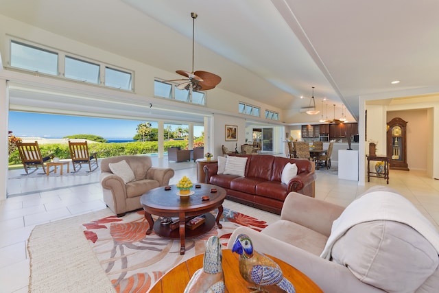 living room with ceiling fan, light tile patterned flooring, and high vaulted ceiling