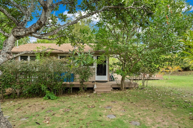 exterior space with a yard and a deck