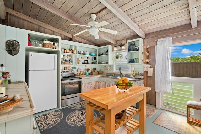 kitchen featuring ceiling fan, lofted ceiling with beams, white fridge, electric stove, and wood ceiling