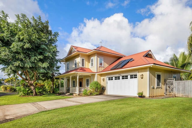 view of front of house with solar panels, a porch, and a front lawn