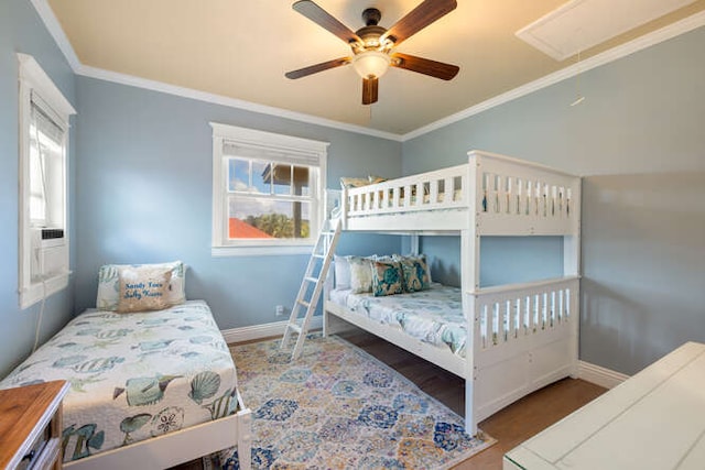 bedroom with ceiling fan and crown molding