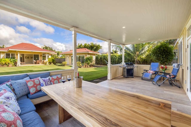 deck featuring a yard, an outdoor living space, and grilling area