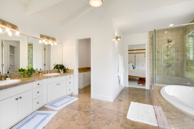 bathroom featuring independent shower and bath, vanity, and lofted ceiling with beams