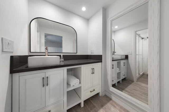 bathroom featuring hardwood / wood-style flooring and vanity