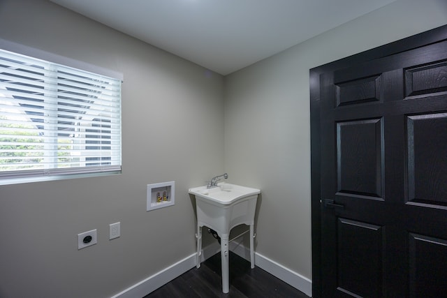 laundry room featuring washer hookup, dark hardwood / wood-style flooring, and electric dryer hookup