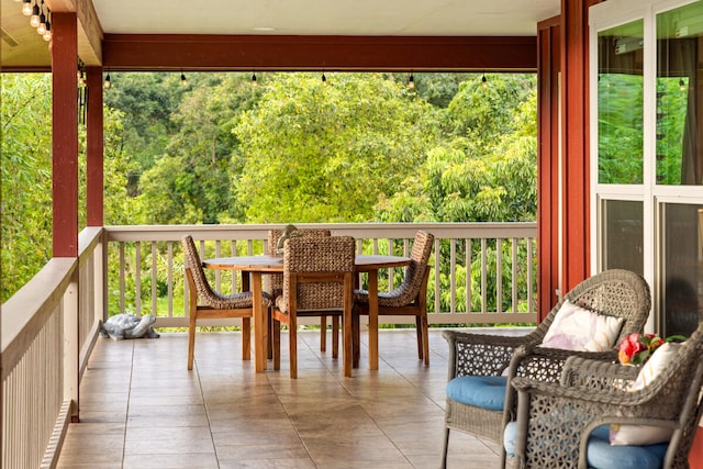 sunroom / solarium featuring a healthy amount of sunlight