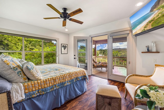 bedroom featuring ceiling fan, dark hardwood / wood-style flooring, access to outside, and multiple windows