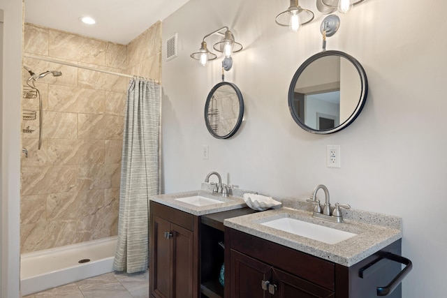 bathroom with curtained shower and vanity