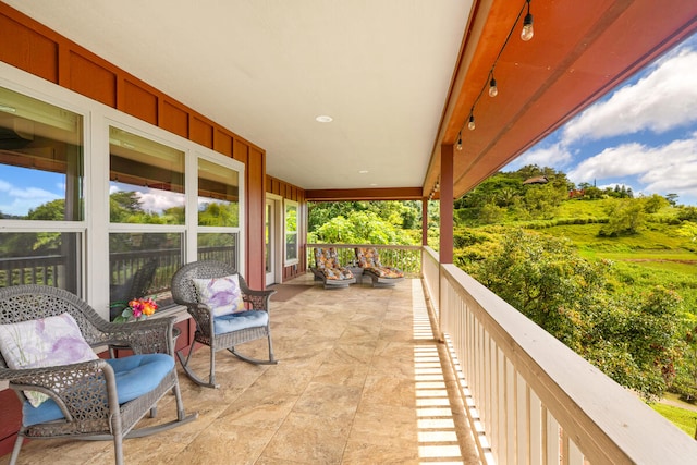 view of patio / terrace with a balcony