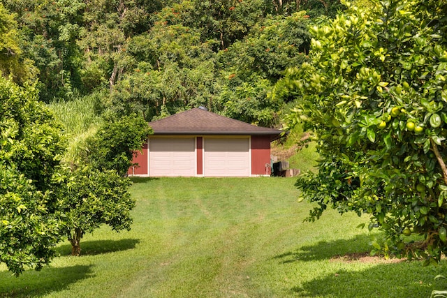 garage with a lawn