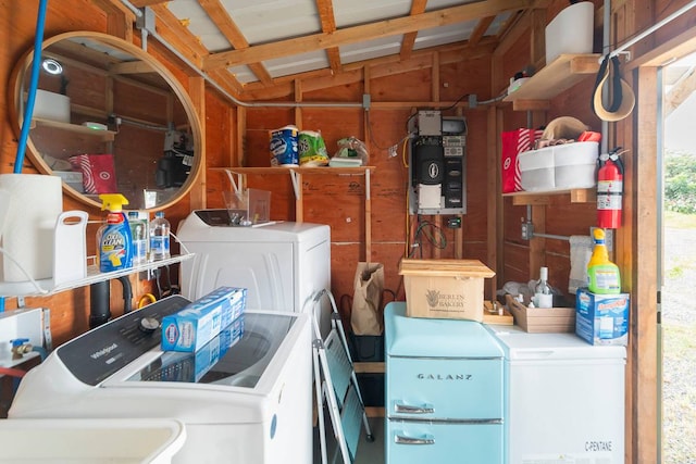 washroom with independent washer and dryer and wooden walls