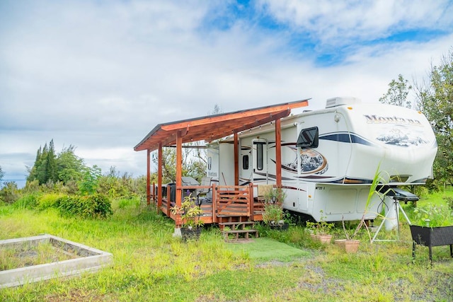 back of property with a deck