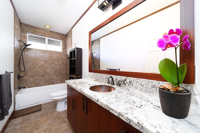 full bathroom with vanity, tiled shower / bath combo, and toilet