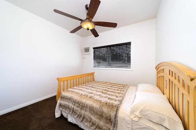 bedroom featuring dark colored carpet and ceiling fan