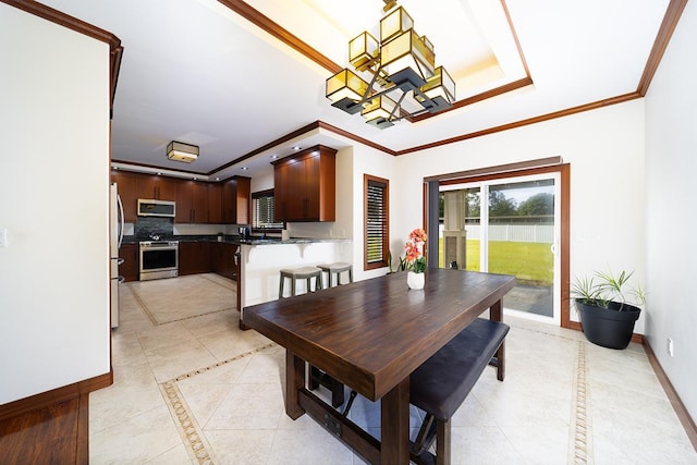 tiled dining area with a notable chandelier and ornamental molding