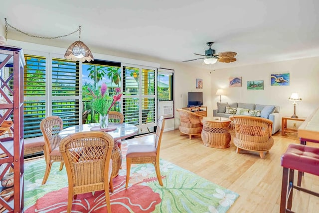 dining area with hardwood / wood-style floors, plenty of natural light, and ceiling fan