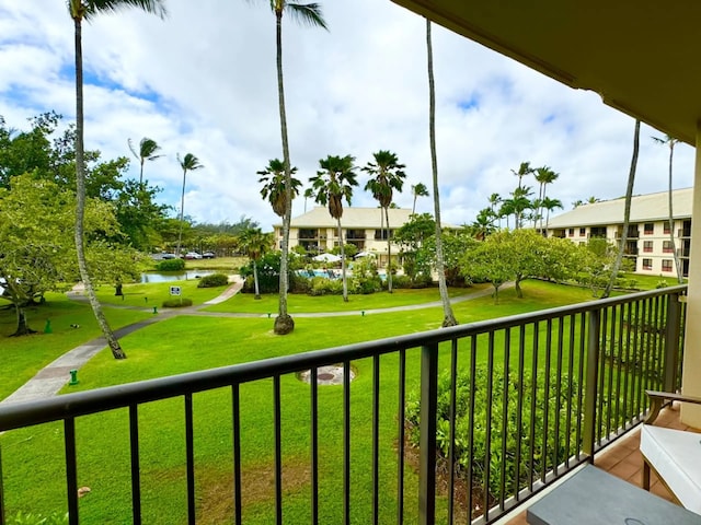 balcony featuring a water view