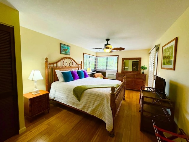 bedroom featuring hardwood / wood-style floors and ceiling fan