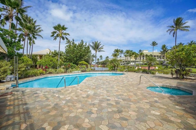 view of swimming pool with a community hot tub and a patio