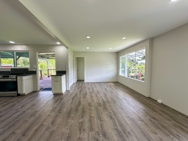 unfurnished living room with wood-type flooring