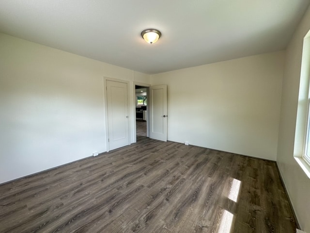 spare room featuring dark hardwood / wood-style flooring