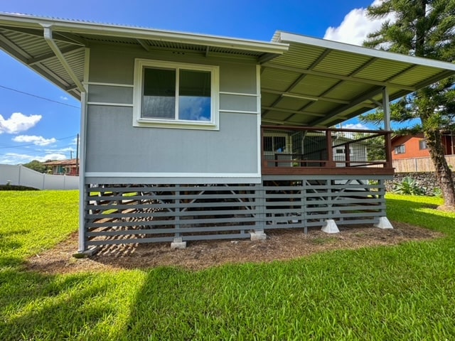 rear view of house with a lawn