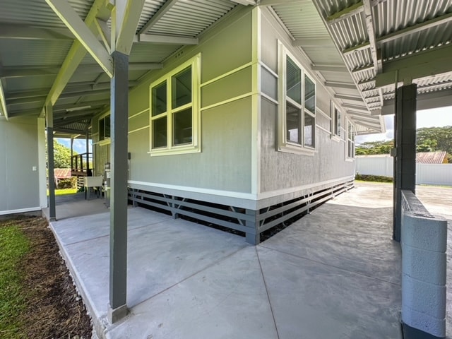 view of property exterior with a patio area