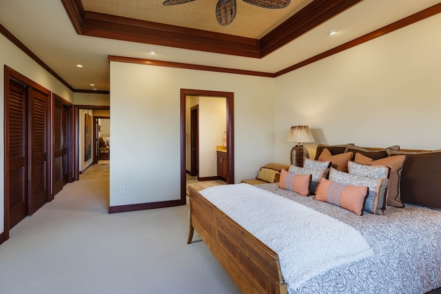 bedroom with light carpet, ensuite bath, ceiling fan, and ornamental molding