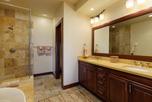 bathroom featuring vanity and an enclosed shower