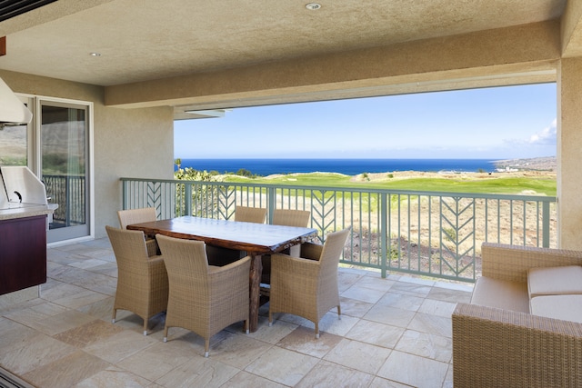 balcony featuring a water view