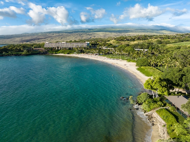 aerial view with a water view and a beach view