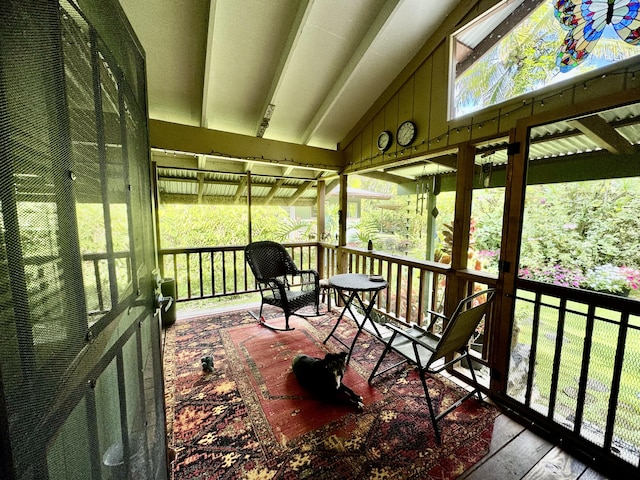 sunroom / solarium with vaulted ceiling