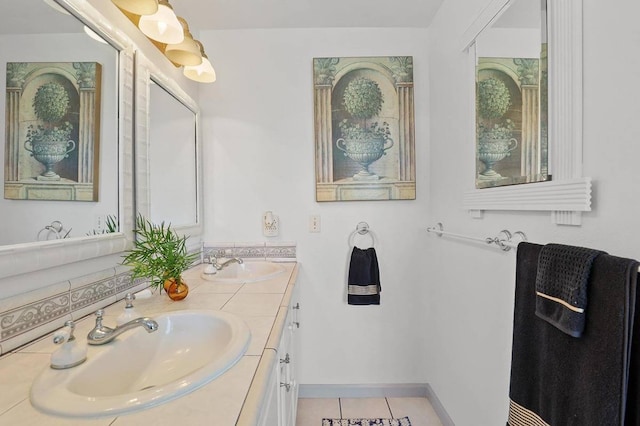 bathroom featuring tile patterned flooring and vanity