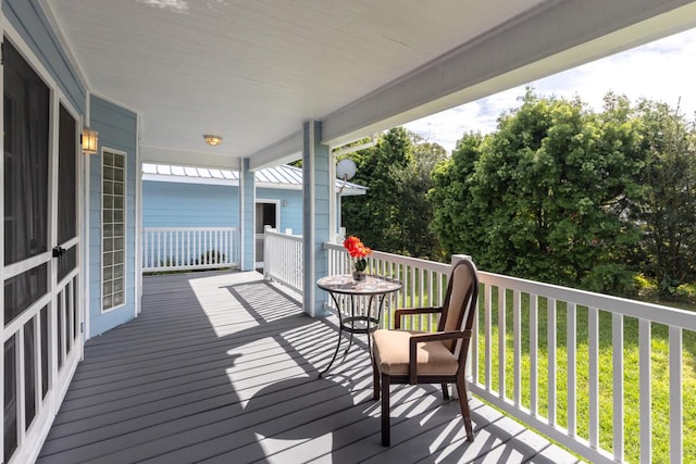 wooden deck featuring covered porch