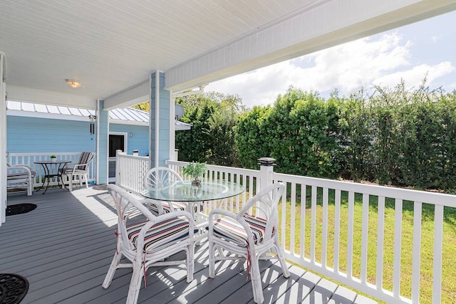 wooden deck with a yard