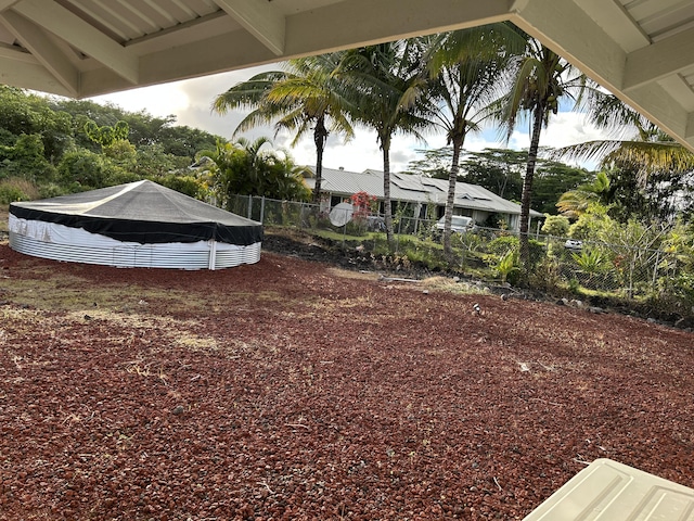 view of yard with a swimming pool